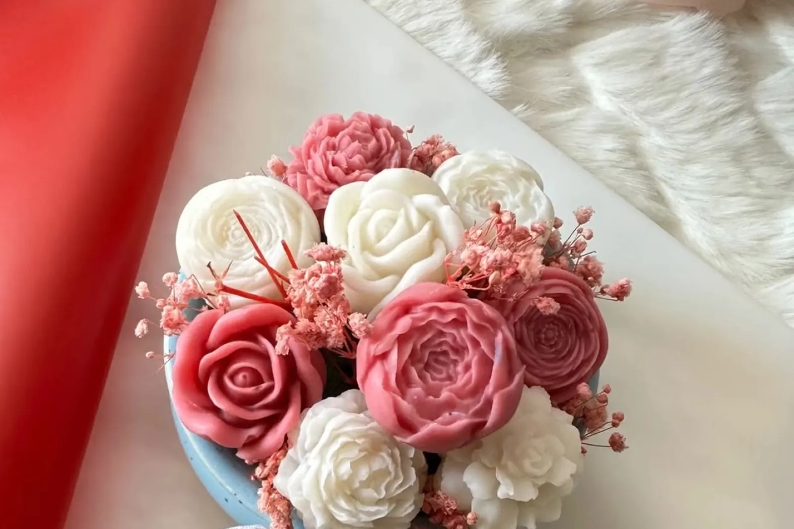 Close-up of hand-shaped wax petals