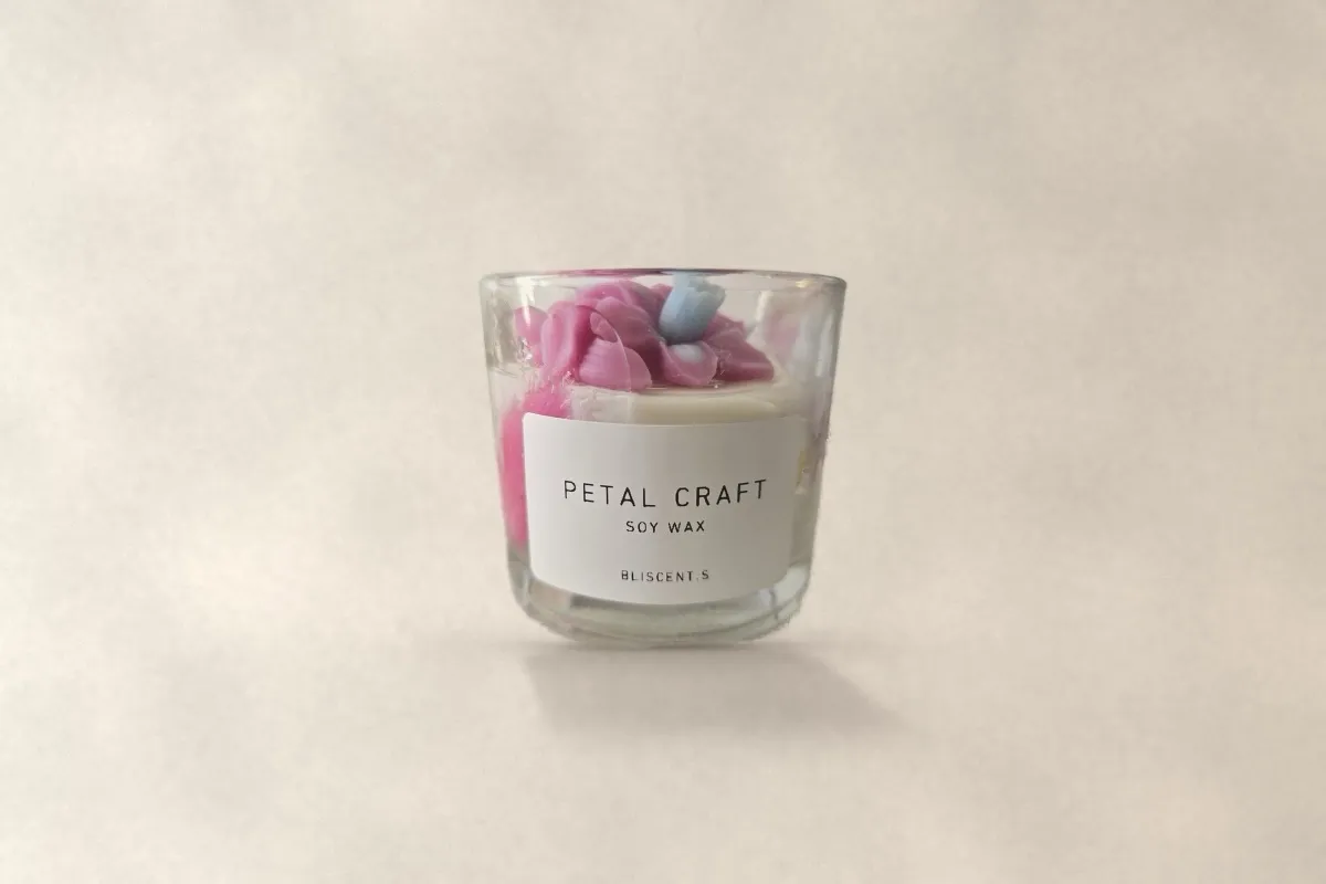 Petal Craft soy jar candle with a pink wax flower on top